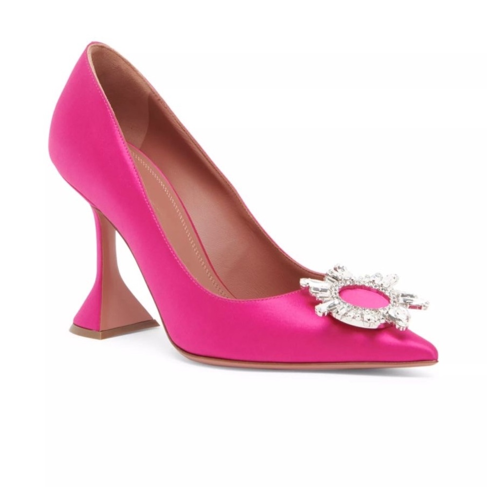 Amina Muaddi pink pumps.